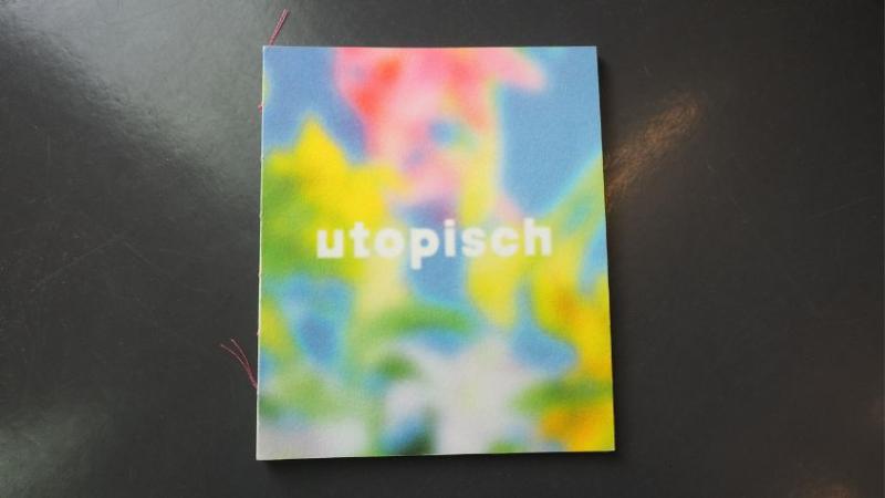 Cover des Magazins "utopisch" auf dunkelgrauem Hintergrund.